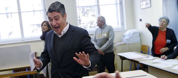 Leader of the Social Democratic Party (SDP) Zoran Milanovic reacts before casting his vote at a polling station during parliamentary election in Zagreb, Croatia, November 8, 2015 Leader of the Social Democratic Party (SDP) Zoran Milanovic reacts before casting his vote at a polling station during parliamentary election in Zagreb, Croatia, November 8, 2015 - Sputnik International