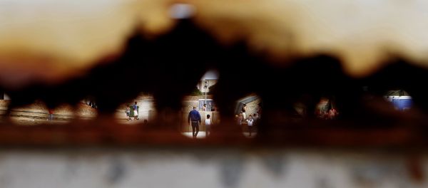 Migrants walk are seen through a hole of the rusty main gate at the temporary transit facility in Dhekelia Garrison, a British military base on the east Mediterranean island of Cyprus on Wednesday, Oct. 28, 2015. Migrants walk are seen through a hole of the rusty main gate at the temporary transit facility in Dhekelia Garrison, a British military base on the east Mediterranean island of Cyprus on Wednesday, Oct. 28, 2015. - Sputnik International