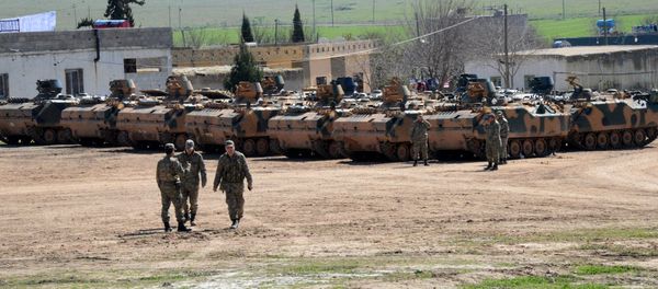 Turkish Army vehicles and tanks wait near the Syrian border in Suruc Turkish Army vehicles and tanks wait near the Syrian border in Suruc - Sputnik International