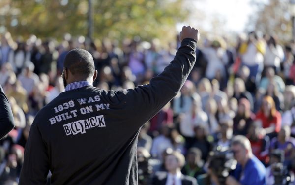 A member of the black student protest group Concerned Student 1950 gestures while addressing a crowd following the announcement that University of Missouri System President Tim Wolfe would resign Monday, Nov. 9, 2015, at the university in Columbia, Mo. Wolfe resigned Monday with the football team and others on campus in open revolt over his handling of racial tensions at the school. A member of the black student protest group Concerned Student 1950 gestures while addressing a crowd following the announcement that University of Missouri System President Tim Wolfe would resign Monday, Nov. 9, 2015, at the university in Columbia, Mo. Wolfe resigned Monday with the football team and others on campus in open revolt over his handling of racial tensions at the school. - Sputnik International