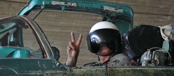 A Syrian pilot before a mission at the Hama airbase near the city of Hama, Syria's Hama Province. A Syrian pilot before a mission at the Hama airbase near the city of Hama, Syria's Hama Province. - Sputnik International