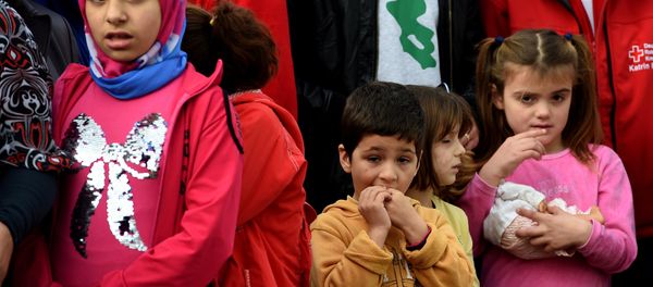Young migrants wait for the arrival of the German President at an accommodation for refugees in Bergisch Gladbach, western Germany, on November 12, 2015. Young migrants wait for the arrival of the German President at an accommodation for refugees in Bergisch Gladbach, western Germany, on November 12, 2015. - Sputnik International