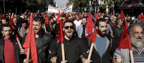 Protesters from the Communist-affiliated trade union PAME take part in an anti-austerity demonstration during a 24-hour general strike in central Athens, Greece November 12, 2015 Protesters from the Communist-affiliated trade union PAME take part in an anti-austerity demonstration during a 24-hour general strike in central Athens, Greece November 12, 2015 - Sputnik International