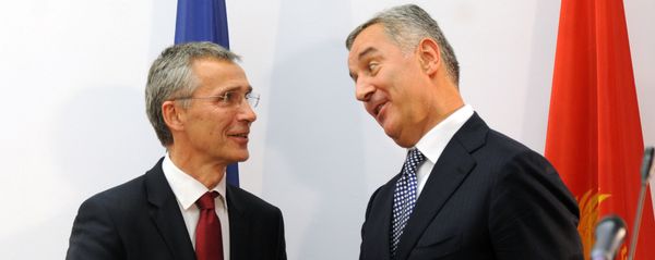 Montenegro's Prime Minister Milo Djukanovic (R) shakes hands with NATO Secretary General Jens Stoltenberg after a joint press conference in Podgorica - Sputnik International