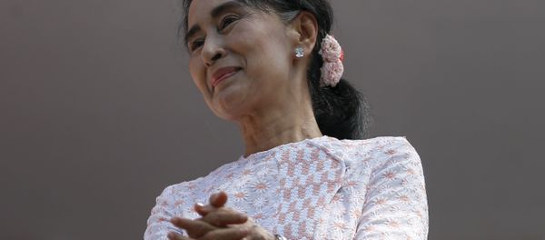 Myanmar's National League for Democracy party leader Suu Kyi looks at supporters after speaking about the general elections in Yangon Myanmar's National League for Democracy party leader Suu Kyi looks at supporters after speaking about the general elections in Yangon - Sputnik International