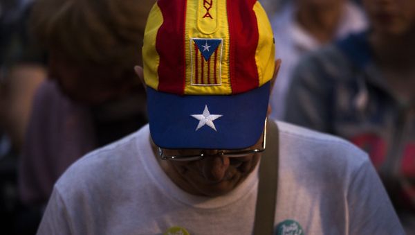 In this Wednesday, Sept. 23, 2015 photo, a pro independence supporter attends a rally of Junts pel Si or Together for YES in Barcelona, Spain. - Sputnik International