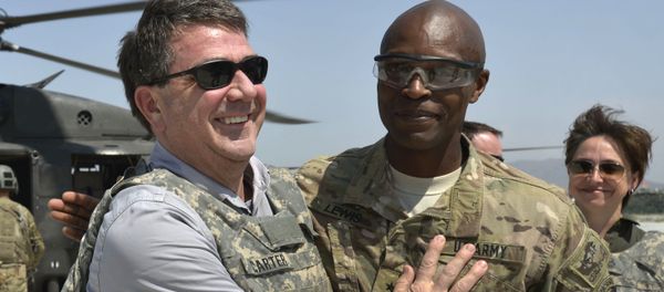 In this photo provided by the Department of Defense, then-U.S. Army Brig. Gen. Ron Lewis, right, greets then-Deputy Secretary of Defense Ash Carter, left, in Jalalabad, Afghanistan, May 13, 2013 In this photo provided by the Department of Defense, then-U.S. Army Brig. Gen. Ron Lewis, right, greets then-Deputy Secretary of Defense Ash Carter, left, in Jalalabad, Afghanistan, May 13, 2013 - Sputnik International