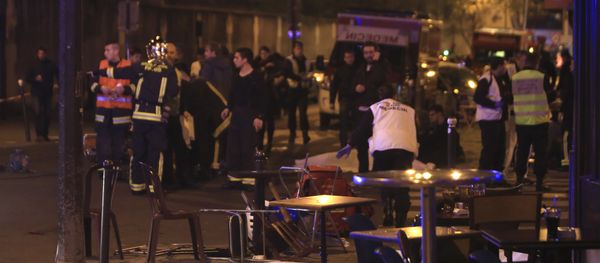Rescue workers and medics work by victims in a Paris restaurant, Friday, Nov. 13, 2015. Police officials in France on Friday reported a shootout in a Paris restaurant and an explosion in a bar near a Paris stadium. - Sputnik International