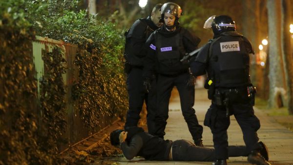 File Photo: A man lies on the ground as French police check his identity near the Bataclan concert hall following fatal shootings in Paris, France, November 13, 2015 - Sputnik International