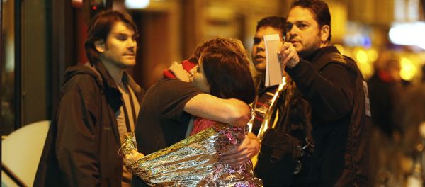 People hug each other before being evacuated by bus, near the Bataclan concert hall in central Paris, on November 14, 2015 People hug each other before being evacuated by bus, near the Bataclan concert hall in central Paris, on November 14, 2015 - Sputnik International