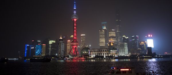 The Oriental Pearl TV Tower (C), in the Lujiazui Financial District in Pudong, is lit in red, white and blue, resembling the colours of the French flag, in Shanghai on November 14, 2015 The Oriental Pearl TV Tower (C), in the Lujiazui Financial District in Pudong, is lit in red, white and blue, resembling the colours of the French flag, in Shanghai on November 14, 2015 - Sputnik International