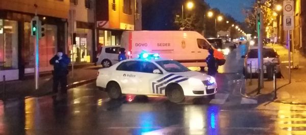 A photo taken on November 14, 2015 with a mobile phone shows a van of the Belgian bomb disposal unit SEDEE as police block a street during a police raid possibly in connection with the November 13 deadly attacks in Paris, in Brussels' Molenbeek district - Sputnik International