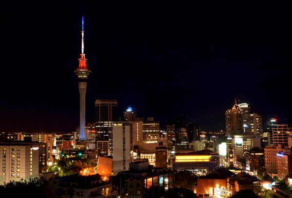 The Sky Tower in Auckland, New Zealand is lit up in the French national colors in solidarity with France after eight extremists wearing explosive belts attacked several venues across Paris, killing 129 people. - Sputnik International