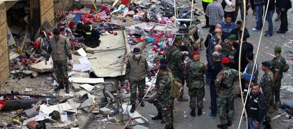 Lebanese Army soldiers stand guard a day after a twin suicide attack in Burj al-Barajneh, southern Beirut, Lebanon, Friday, Nov. 13, 2015 - Sputnik International
