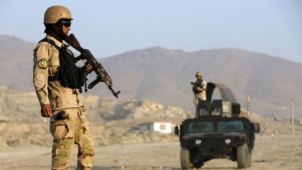 File photo of an Afghan policemen stand guard at a checkpoint in the Deh Sabz district of Kabul, Afghanistan October 14, 2015 - Sputnik International