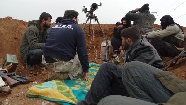 Opposition fighters from the Ahrar Al-Sham brigade, part of the Islamic front coalition, hold a position in the Sheikh Lutfi neighbourhood of the northern Syrian city of Aleppo during ongoing clashes with government forces on January 27, 2014 Opposition fighters from the Ahrar Al-Sham brigade, part of the Islamic front coalition, hold a position in the Sheikh Lutfi neighbourhood of the northern Syrian city of Aleppo during ongoing clashes with government forces on January 27, 2014 - Sputnik International