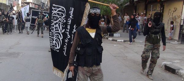 Islamic fighters from the al-Qaida group in the Levant, Al-Nusra Front, wave their movement's flag as they parade at the Yarmuk Palestinian refugee camp, south of Damascus, to denounce Israel’s military offensive on the Gaza Strip, on July 28, 2014 Islamic fighters from the al-Qaida group in the Levant, Al-Nusra Front, wave their movement's flag as they parade at the Yarmuk Palestinian refugee camp, south of Damascus, to denounce Israel’s military offensive on the Gaza Strip, on July 28, 2014 - Sputnik International