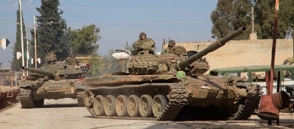 Syrian Army tanks enter a village near the Kweyris military air base, in the east of the northern Syrian province of Aleppo, after they took control of the surrounding villages from Daesh. file photo - Sputnik International