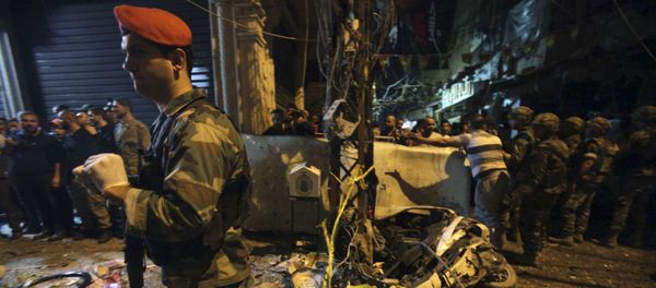 Residents and Lebanese army members inspect a damaged area caused by two explosions in Beirut's southern suburbs, Lebanon November 12, 2015 Residents and Lebanese army members inspect a damaged area caused by two explosions in Beirut's southern suburbs, Lebanon November 12, 2015 - Sputnik International