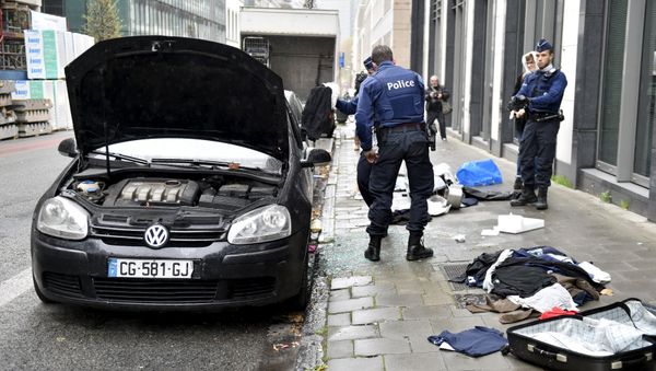 Police officers check a suspected car during an alert in Brussels, Belgium, November 16, 2015, following the deadly attacks in Paris Police officers check a suspected car during an alert in Brussels, Belgium, November 16, 2015, following the deadly attacks in Paris - Sputnik International