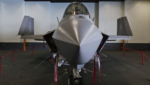 An F-35C Lightning II test aircraft is on static display in the hanger deck of the nuclear powered aircraft carrier USS Dwight D. Eisenhower of the coast of Norfolk, Va., Friday, Oct. 9, 2015. - Sputnik International