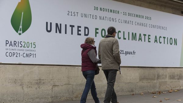 Pedestrians walk in front of posters for the forthcoming COP 21 World Climate Summit in Paris, France, November 2, 2015 Pedestrians walk in front of posters for the forthcoming COP 21 World Climate Summit in Paris, France, November 2, 2015 - Sputnik International