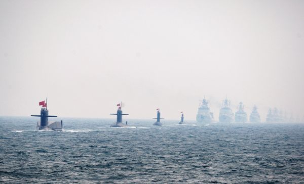 Four Chinese Navy submarines (L) and warships attend an international fleet review to celebrate the 60th anniversary of the founding of the People's Liberation Army Navy on April 23, 2009 off Qingdao in Shandong Province Four Chinese Navy submarines (L) and warships attend an international fleet review to celebrate the 60th anniversary of the founding of the People's Liberation Army Navy on April 23, 2009 off Qingdao in Shandong Province - Sputnik International