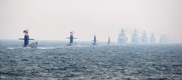 Four Chinese Navy submarines (L) and warships attend an international fleet review to celebrate the 60th anniversary of the founding of the People's Liberation Army Navy on April 23, 2009 off Qingdao in Shandong Province Four Chinese Navy submarines (L) and warships attend an international fleet review to celebrate the 60th anniversary of the founding of the People's Liberation Army Navy on April 23, 2009 off Qingdao in Shandong Province - Sputnik International