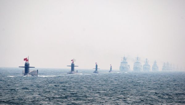 Four Chinese Navy submarines (L) and warships attend an international fleet review to celebrate the 60th anniversary of the founding of the People's Liberation Army Navy on April 23, 2009 off Qingdao in Shandong Province - Sputnik International