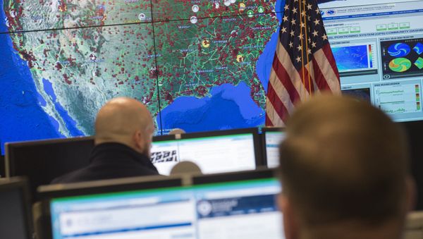 Staff members sit at their work stations at the National Cybersecurity and Communications Integration Center in Arlington, Virginia, January 13, 2015 Staff members sit at their work stations at the National Cybersecurity and Communications Integration Center in Arlington, Virginia, January 13, 2015 - Sputnik International