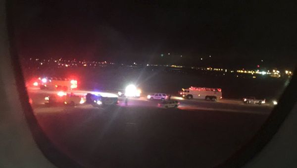 Emergency personnel are shown on the tarmac at Salt Lake City International Airport in this photograph taken by passenger Keith Rosso from a seat inside Air France flight 65, November 17, 2015 Emergency personnel are shown on the tarmac at Salt Lake City International Airport in this photograph taken by passenger Keith Rosso from a seat inside Air France flight 65, November 17, 2015 - Sputnik International
