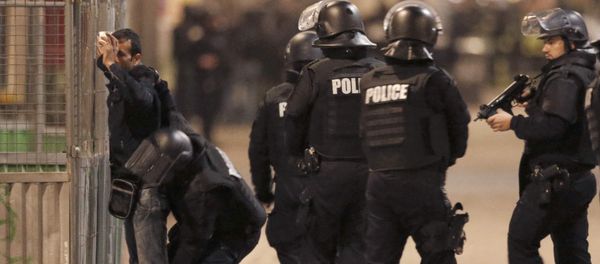 French spolice stop and search a local resident as shots are exchanged in Saint-Denis, France, near Paris, November 18, 2015 during an operation to catch fugitives from Friday night's deadly attacks in the French capital French spolice stop and search a local resident as shots are exchanged in Saint-Denis, France, near Paris, November 18, 2015 during an operation to catch fugitives from Friday night's deadly attacks in the French capital - Sputnik International