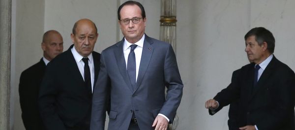 French President Francois Hollande (C) and French Defence minister Jean-Yves Le Drian (L) leave the weekly cabinet meeting at the Elysee Palace in Paris French President Francois Hollande (C) and French Defence minister Jean-Yves Le Drian (L) leave the weekly cabinet meeting at the Elysee Palace in Paris - Sputnik International