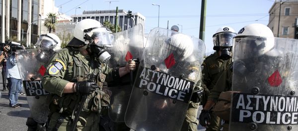 Policemen detain a farmer during an anti-government protest at central Syntagma square in Athens Policemen detain a farmer during an anti-government protest at central Syntagma square in Athens - Sputnik International