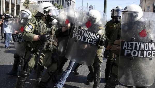 Policemen detain a farmer during an anti-government protest at central Syntagma square in Athens Policemen detain a farmer during an anti-government protest at central Syntagma square in Athens - Sputnik International