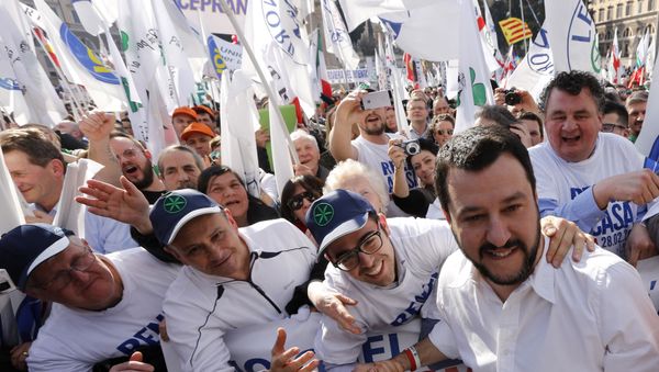 Italian Lega Nord (Northern League) party Matteo Salvini, second right, poses for pictures with supporters during a protest to demand the Italian government keep out immigrants in Rome - Sputnik International