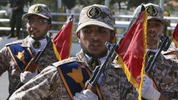 Iran's Revolutionary Guard troops march in a military parade. - Sputnik International