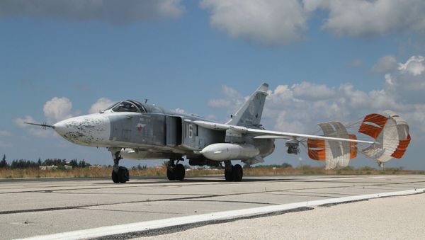 A Russian Su-24 front-line bomber jet lands at Latakia airport, Syria. A Russian Su-24 front-line bomber jet lands at Latakia airport, Syria. - Sputnik International