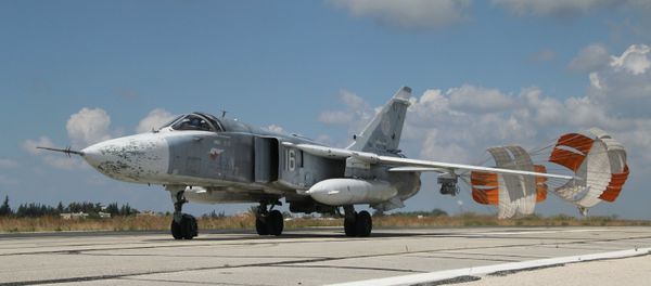 A Russian Su-24 front-line bomber jet lands at Latakia airport, Syria. A Russian Su-24 front-line bomber jet lands at Latakia airport, Syria. - Sputnik International