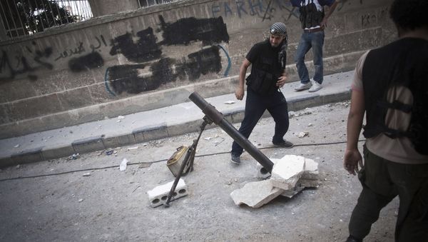 A Free Syrian Army fighter shoots a mortar against Syrian Army positions in the Izaa district in Aleppo, Syria, Tuesday, Sept. 11, 2012. A Free Syrian Army fighter shoots a mortar against Syrian Army positions in the Izaa district in Aleppo, Syria, Tuesday, Sept. 11, 2012. - Sputnik International