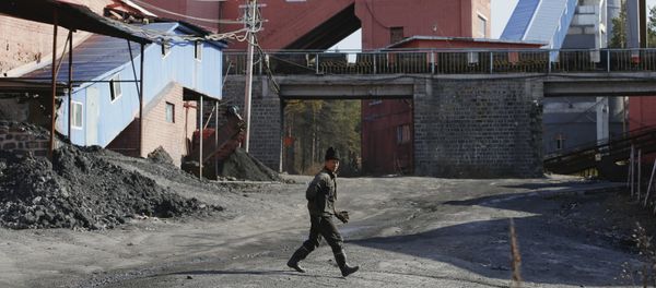 A miner walks at a coal mine, China A miner walks at a coal mine, China - Sputnik International