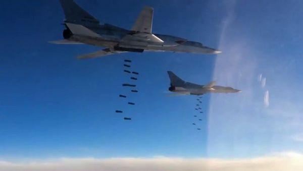 A Tupolev Tu-22M3 long-range strategic and maritime strike bomber of the Russian Aerospace Forces during a combat flight to strike the Islamic State infrastructure facilities in Syria by OFAB-25-270 fragmentation high explosive bombs - Sputnik International