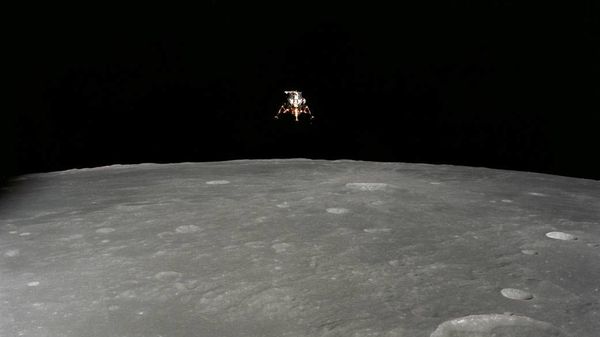 The Apollo 12 Lunar Module (LM), in a lunar landing configuration, is photographed in lunar orbit from the Command and Service Modules (CSM) on Nov. 19, 1969 - Sputnik International