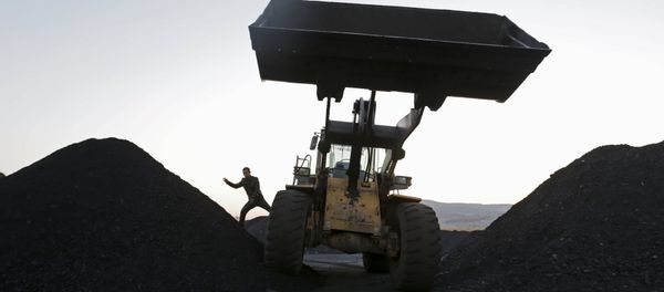 A driver gets off a loading vehicle at local businessman Sun Meng's small coal depot near a coal mine of the state-owned Longmay Group on the outskirts of Jixi, in Heilongjiang province, China, October 23, 2015 A driver gets off a loading vehicle at local businessman Sun Meng's small coal depot near a coal mine of the state-owned Longmay Group on the outskirts of Jixi, in Heilongjiang province, China, October 23, 2015 - Sputnik International