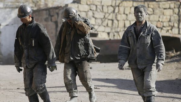 Miners walk at a coal mine from the state-owned Longmay Group on the outskirts of Jixi, in Heilongjiang province, China, October 24, 2015 - Sputnik International