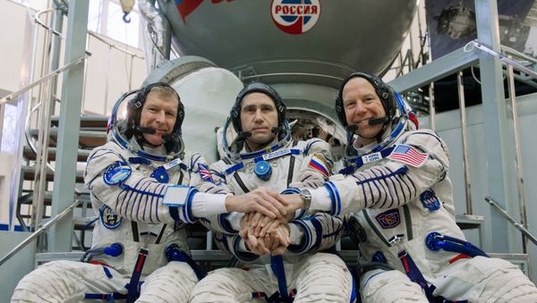 ISS expedition 46/47 crew members, from left: British ESA astronaut Timothy Peake, Russian cosmonaut Yuri Malenchenko and US NASA astronaut Timothy Kopra in front of Soyuz TMA-M space craft simulator ISS expedition 46/47 crew members, from left: British ESA astronaut Timothy Peake, Russian cosmonaut Yuri Malenchenko and US NASA astronaut Timothy Kopra in front of Soyuz TMA-M space craft simulator - Sputnik International