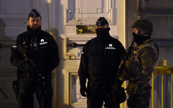 Belgian policemen and a serviceman secure an area during a press conference by the Belgian prime minister concerning the country's security alert level in Brussels on November 22, 2015. - Sputnik International
