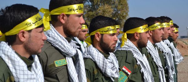 Fighters from the Iraqi Imam Ali Brigade, belonging to the Badr Organisation headed by former Iraqi Transport Minister Hadi al-Amiri, take part in a graduation ceremony in Taza Khurmatu, 20 kms south of Kirkuk, on February 26, 2015. Fighters from the Iraqi Imam Ali Brigade, belonging to the Badr Organisation headed by former Iraqi Transport Minister Hadi al-Amiri, take part in a graduation ceremony in Taza Khurmatu, 20 kms south of Kirkuk, on February 26, 2015. - Sputnik International