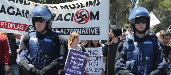 Members of the Campaign Against Racism and Fascism hold a counter-rally against anti-Islam group Reclaim Australia, as the latter group - who have organised county-wide protests around the country in the wake of the Paris terror attacks - protest over plans for a mosque in Melton, in Melbourne on November 22, 2015. - Sputnik International