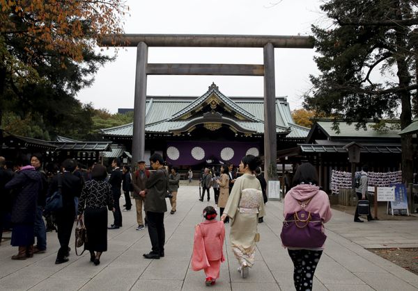 People walk near the main shrine after a blast at the precinct of the Yasukuni shrine in Tokyo, Japan, November 23, 2015 People walk near the main shrine after a blast at the precinct of the Yasukuni shrine in Tokyo, Japan, November 23, 2015 - Sputnik International